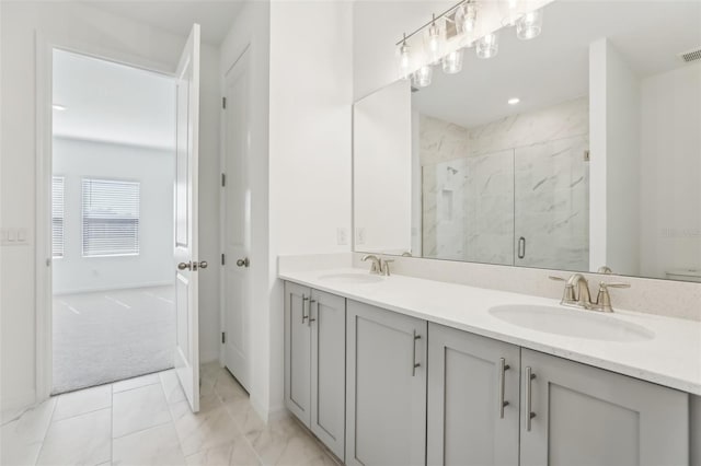 bathroom featuring vanity and an enclosed shower