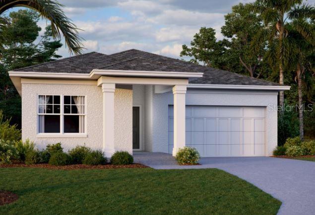 view of front of property with a garage and a front yard