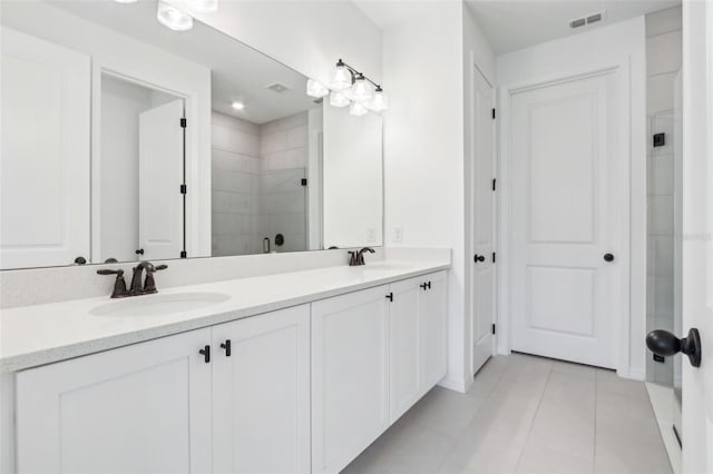 full bath featuring a shower stall, visible vents, a sink, and tile patterned floors