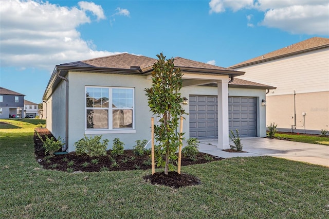 view of front of property with an attached garage, driveway, roof with shingles, stucco siding, and a front yard