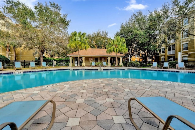 view of pool featuring fence