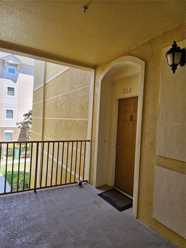 3338 Robert Trent Jones Dr Unit 20804, Orlando, FL 32835 - doorway to property featuring a balcony and stucco siding