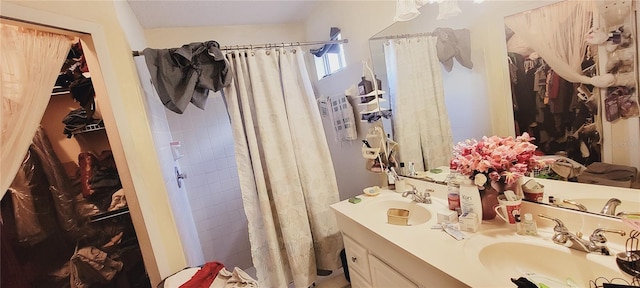 bathroom featuring a shower with curtain and vanity