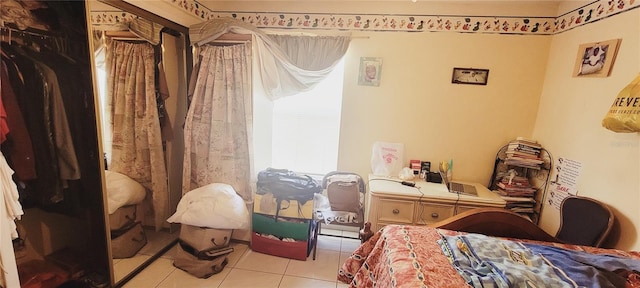 bedroom featuring light tile patterned flooring