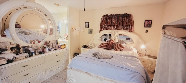 bedroom featuring light tile patterned flooring