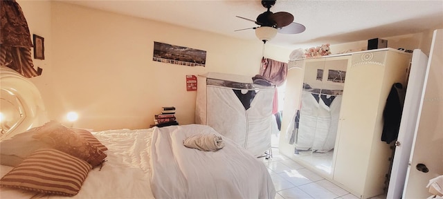 tiled bedroom featuring ceiling fan