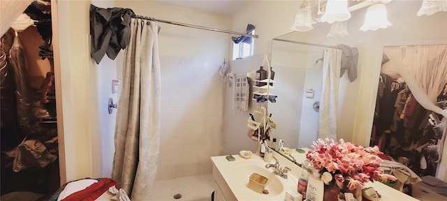 bathroom featuring sink and curtained shower