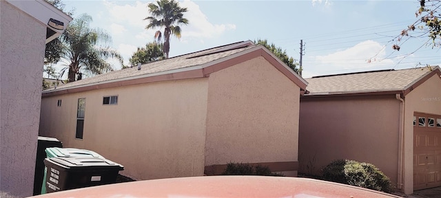 view of side of property with a garage