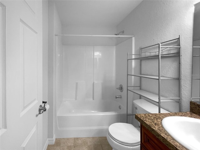 full bathroom featuring vanity, tile patterned floors, toilet, and bathtub / shower combination