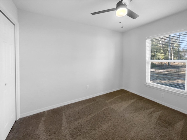 carpeted empty room with ceiling fan