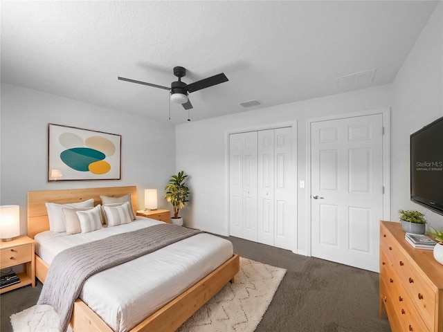 carpeted bedroom with a closet and ceiling fan