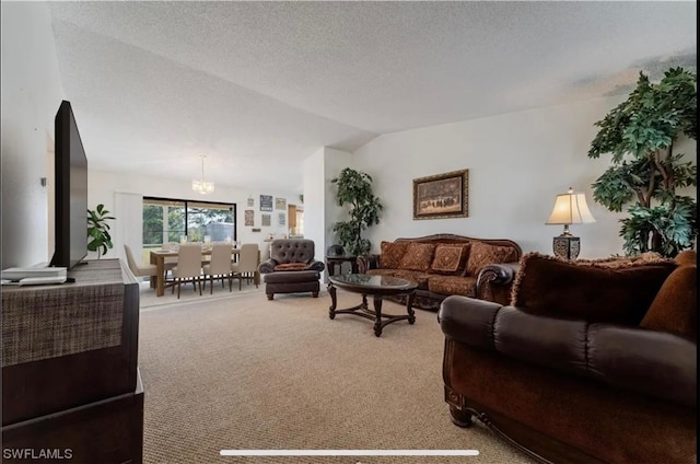 living area featuring lofted ceiling, carpet, and a textured ceiling