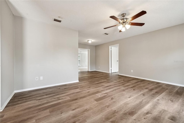 353 E Orange St, Altamonte Springs, FL 32701 - spare room with hardwood / wood-style flooring, ceiling fan, and a textured ceiling