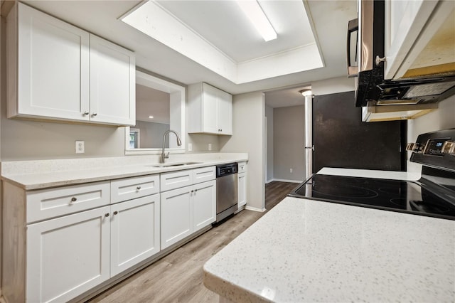 353 E Orange St, Altamonte Springs, FL 32701 - kitchen with sink, stainless steel appliances, and white cabinets