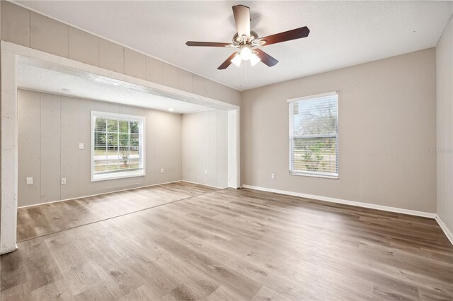 353 E Orange St, Altamonte Springs, FL 32701 - unfurnished room with wood-type flooring, a textured ceiling, and ceiling fan