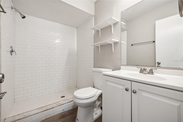 353 E Orange St, Altamonte Springs, FL 32701 - bathroom with vanity, toilet, hardwood / wood-style floors, and a tile shower