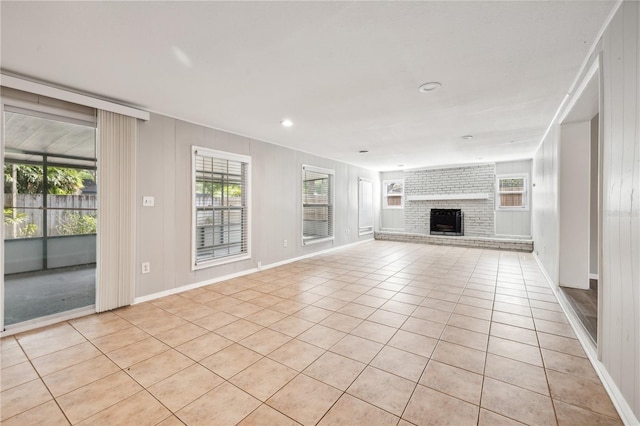 353 E Orange St, Altamonte Springs, FL 32701 - unfurnished living room featuring light tile patterned floors and a fireplace