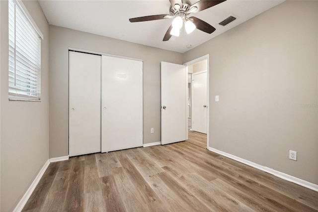 353 E Orange St, Altamonte Springs, FL 32701 - unfurnished bedroom featuring light hardwood / wood-style flooring, a closet, and ceiling fan