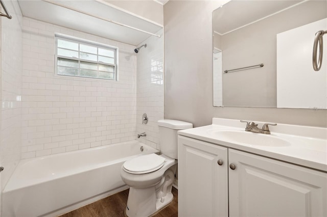 353 E Orange St, Altamonte Springs, FL 32701 - full bathroom featuring vanity, toilet, hardwood / wood-style floors, and tiled shower / bath