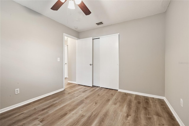 353 E Orange St, Altamonte Springs, FL 32701 - unfurnished bedroom with a closet, ceiling fan, and light hardwood / wood-style flooring