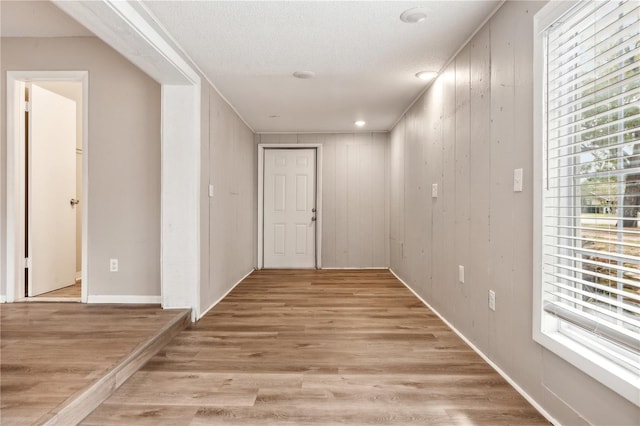 353 E Orange St, Altamonte Springs, FL 32701 - hallway with light hardwood / wood-style floors and a textured ceiling
