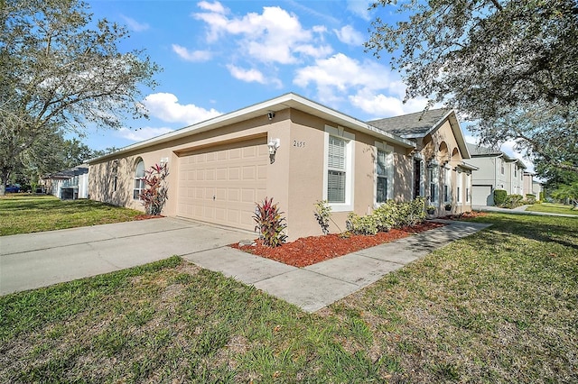 view of home's exterior featuring stucco siding, a lawn, a garage, and concrete driveway