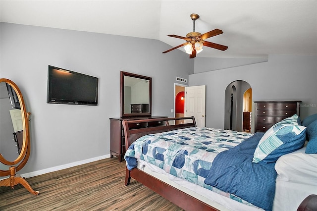 bedroom featuring ceiling fan, dark hardwood / wood-style flooring, and vaulted ceiling