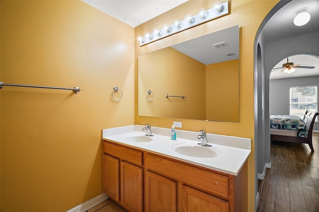 bathroom featuring vanity, hardwood / wood-style flooring, and ceiling fan