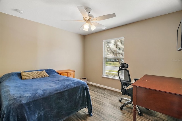 bedroom with wood-type flooring and ceiling fan