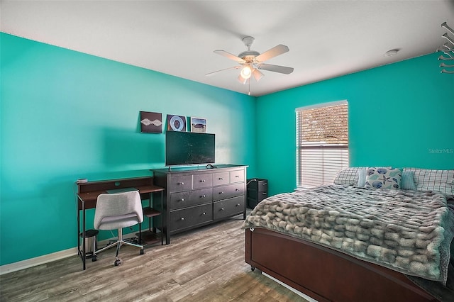 bedroom featuring hardwood / wood-style flooring and ceiling fan