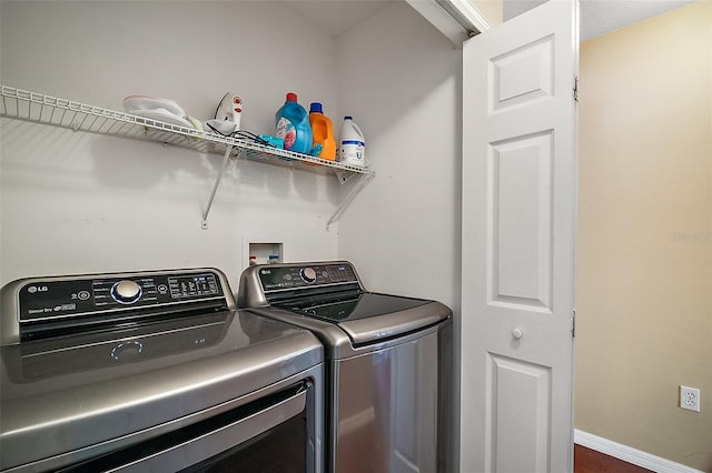 laundry room featuring separate washer and dryer