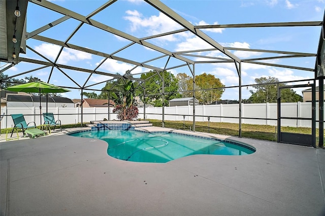 view of swimming pool featuring a lanai and a patio area