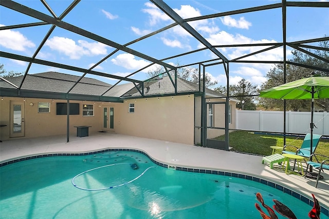 view of pool with a patio area, french doors, and glass enclosure