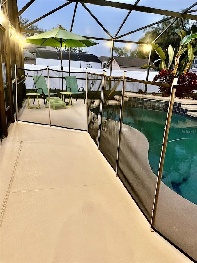 view of pool featuring a patio and a lanai