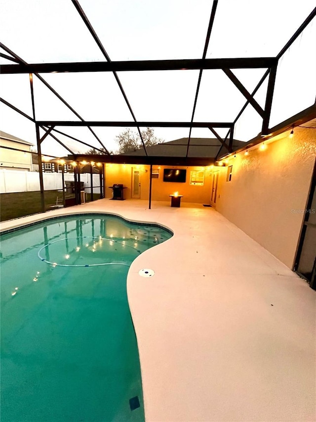 view of pool featuring a patio and a lanai