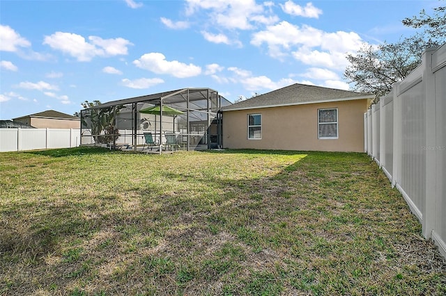 view of yard with a lanai