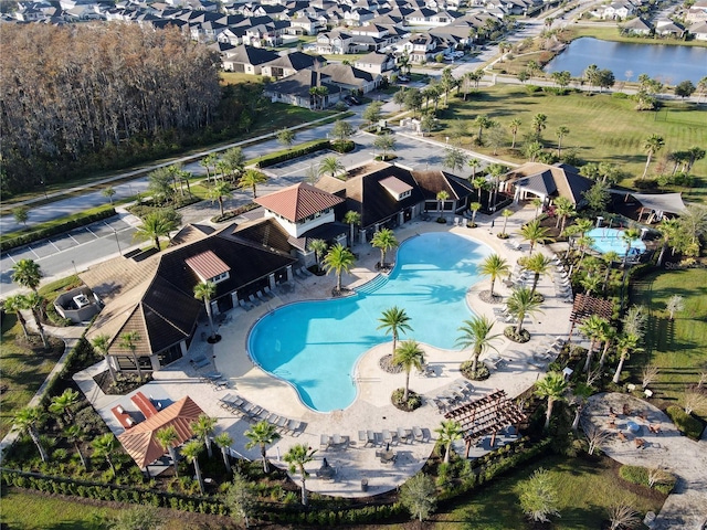 birds eye view of property featuring a water view