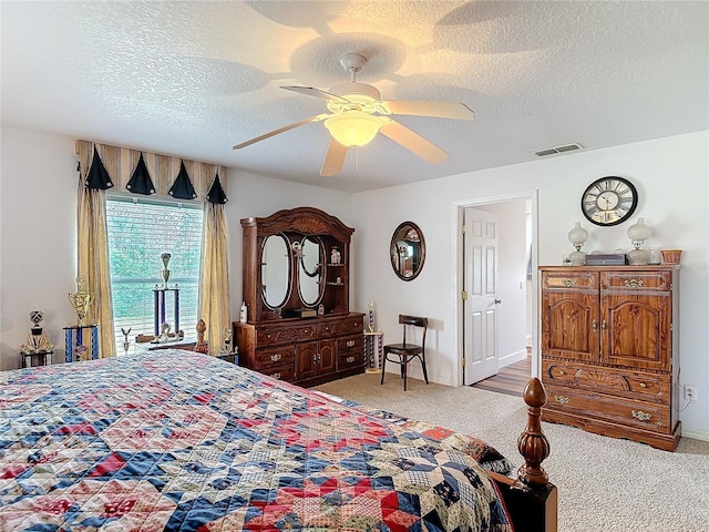 carpeted bedroom featuring a textured ceiling, access to outside, and ceiling fan