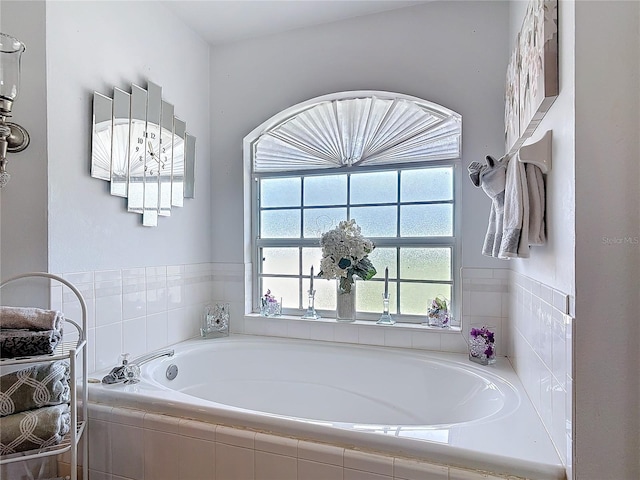 bathroom with tiled tub