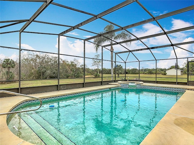 view of swimming pool with an in ground hot tub, a lanai, and a patio area