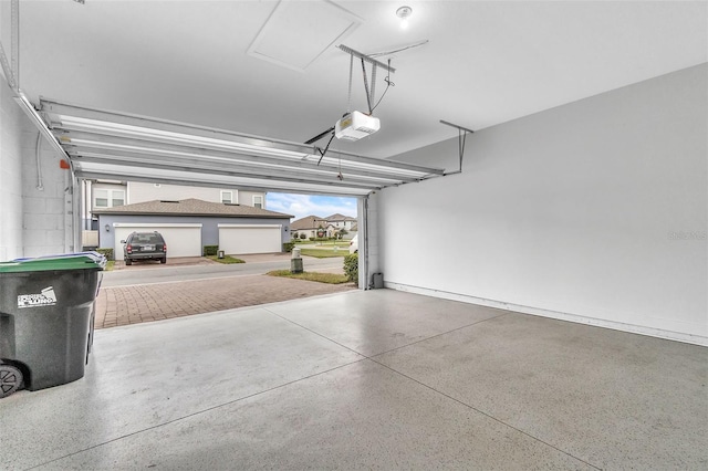 garage featuring a garage door opener