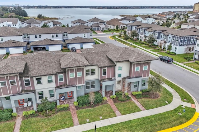 drone / aerial view with a water view