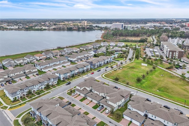 birds eye view of property with a water view