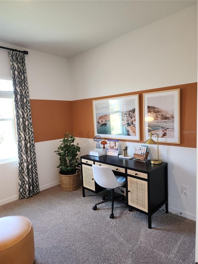 carpeted home office featuring baseboards