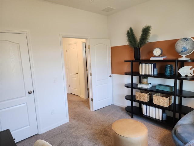 interior space featuring baseboards and visible vents