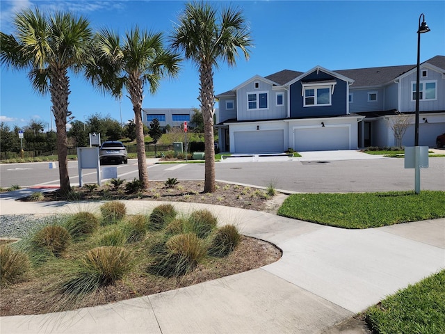 exterior space with concrete driveway and an attached garage