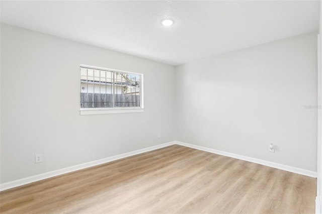 unfurnished room featuring light wood-type flooring