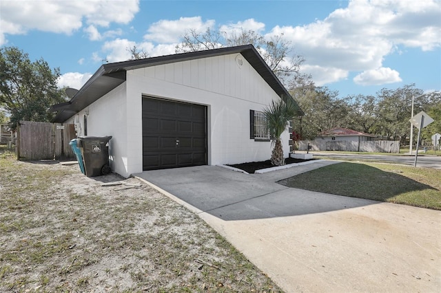 view of side of home featuring a garage