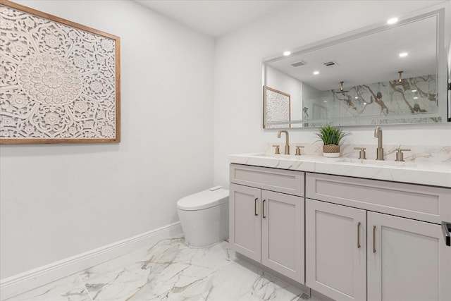 full bath featuring marble finish floor, a sink, and toilet