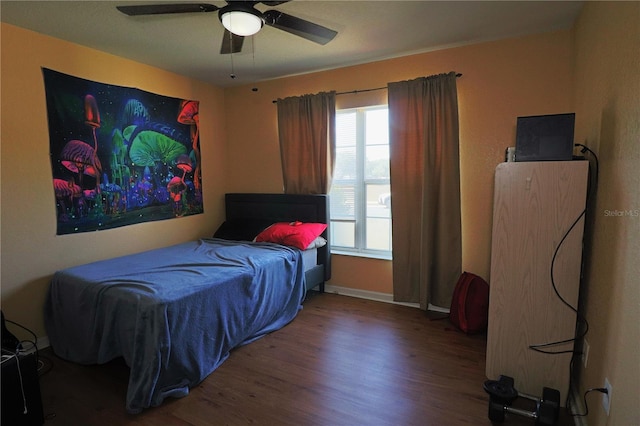 bedroom with hardwood / wood-style floors and ceiling fan